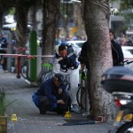 zzzzinte1Israeli forensics inspect the site of an attack by an unidentified gunman, who opened fire at a pub in the Israeli city of Tel Aviv killing two people and wounding five others on January 1, 2016, police and medical officials said. An eyewitness told Channel 1 television the assailant used an automatic weapon against people at a pub. AFP PHOTO / JACK GUEZzzzz